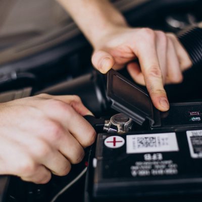 Hands connecting battery